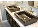 Bathroom close-up of double vanity, sleek fixtures, and under-cabinet storage at 1809 E Gwen St, Phoenix, AZ 85042