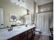 Bright bathroom featuring double sinks, a large mirror, and ample counter space at 1809 E Gwen St, Phoenix, AZ 85042
