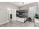 Cozy bedroom features a triple bunk bed and a comfortable, bright decor at 1809 E Gwen St, Phoenix, AZ 85042
