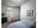Cozy bedroom featuring a comfortable bed and natural light from a window at 1809 E Gwen St, Phoenix, AZ 85042