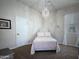 Charming bedroom with chandelier, plush bed, and decorative accents creating a cozy retreat at 1809 E Gwen St, Phoenix, AZ 85042