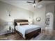 Primary bedroom featuring natural light, dark furniture, and a spacious layout at 1809 E Gwen St, Phoenix, AZ 85042