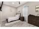 Bright bedroom with wood floors and a dresser at 1809 E Gwen St, Phoenix, AZ 85042