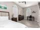 This bedroom features wood floors, a desk, and a ceiling fan at 1809 E Gwen St, Phoenix, AZ 85042