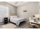 This bedroom features gray wood floors and walls, along with a desk area at 1809 E Gwen St, Phoenix, AZ 85042
