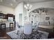 Open dining and kitchen area with dark floors and elegant finishes throughout at 1809 E Gwen St, Phoenix, AZ 85042