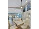 Bright, open-concept space featuring a kitchen island, modern dining set, and seamless flow to the living area at 1809 E Gwen St, Phoenix, AZ 85042