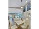 Bright, open-concept space featuring a kitchen island, modern dining set, and seamless flow to the living area at 1809 E Gwen St, Phoenix, AZ 85042