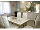 Luxurious dining room features a marble table with plush chairs and modern decor at 1809 E Gwen St, Phoenix, AZ 85042
