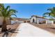 A view of the house, including the front yard, driveway, and exterior walls with landscaping at 1809 E Gwen St, Phoenix, AZ 85042