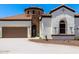 Charming single-story home featuring a tile roof, stucco exterior, and a two-car garage at 1809 E Gwen St, Phoenix, AZ 85042