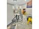 Upstairs game room featuring fun decor, a spiral staircase, and a dazzling chandelier at 1809 E Gwen St, Phoenix, AZ 85042