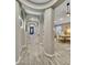 Hallway featuring a series of elegant archways leading to the dining room and entrance at 1809 E Gwen St, Phoenix, AZ 85042