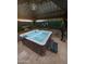 Hot tub under covered gazebo, perfect for relaxation and entertainment at 1809 E Gwen St, Phoenix, AZ 85042