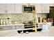Modern kitchen with sleek countertops, stainless steel appliances, and stylish backsplash at 1809 E Gwen St, Phoenix, AZ 85042