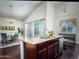 Kitchen island with sink and granite countertop, connecting to the dining area at 1809 E Gwen St, Phoenix, AZ 85042