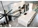 Modern kitchen featuring white cabinets, marble countertops, and a large island with seating at 1809 E Gwen St, Phoenix, AZ 85042