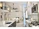 Open-concept kitchen with stainless steel appliances, sleek countertops, and an adjacent dining area at 1809 E Gwen St, Phoenix, AZ 85042