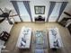Open-concept living room with neutral sofas, ceiling fans, and natural light from above at 1809 E Gwen St, Phoenix, AZ 85042
