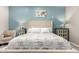 View of the bright main bedroom with soft décor, side tables, and comfortable seating at 1809 E Gwen St, Phoenix, AZ 85042