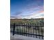 A view of the desert landscape and surrounding mountains from behind a black iron fence at 1809 E Gwen St, Phoenix, AZ 85042