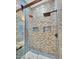 Modern shower with blue mosaic tile, dual shower heads, and glass door at 1809 E Gwen St, Phoenix, AZ 85042