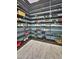 Custom shoe shelving in the walk-in closet creates space for many shoes and accessories at 1809 E Gwen St, Phoenix, AZ 85042