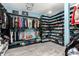 Spacious walk-in closet with open shelving for organized storage of clothes and shoes at 1809 E Gwen St, Phoenix, AZ 85042