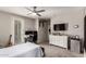 Spacious bedroom with natural lighting, ceiling fan, and a white dresser at 18459 E Ranch Rd, Queen Creek, AZ 85142