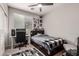 Bedroom features a modern ceiling fan, and a window for natural lighting at 18459 E Ranch Rd, Queen Creek, AZ 85142