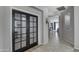 Inviting entryway featuring decorative glass french doors leading to office or flex space at 18459 E Ranch Rd, Queen Creek, AZ 85142