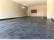Spacious garage featuring ample storage cabinets and durable flooring for vehicles and equipment at 18459 E Ranch Rd, Queen Creek, AZ 85142