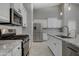 Spacious kitchen featuring stainless steel appliances, granite countertops and ample cabinet space at 18459 E Ranch Rd, Queen Creek, AZ 85142