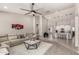 Bright, open living room seamlessly connects to the kitchen, creating a harmonious and inviting living space at 18459 E Ranch Rd, Queen Creek, AZ 85142