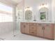 Modern bathroom with a glass shower and double vanity at 18812 N 90Th Pl, Scottsdale, AZ 85255