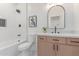 Bathroom featuring white subway tile, dark fixtures and a light wood vanity at 18812 N 90Th Pl, Scottsdale, AZ 85255