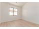 Bright bedroom featuring light colored hardwood flooring and a large window at 18812 N 90Th Pl, Scottsdale, AZ 85255