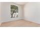 Bright bedroom featuring hardwood floors and a large arched window at 18812 N 90Th Pl, Scottsdale, AZ 85255