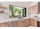 Spacious kitchen with a garden view and modern appliances at 18812 N 90Th Pl, Scottsdale, AZ 85255