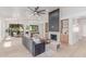 Open-concept living room with modern fireplace and ample natural light at 18812 N 90Th Pl, Scottsdale, AZ 85255