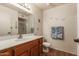 Well-lit bathroom featuring wood vanity with white countertop and ample storage at 2105 S Zinnia Ave # 468, Mesa, AZ 85209