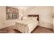 Comfortable bedroom with hardwood floors, a queen-sized bed, and a decorative headboard at 2105 S Zinnia Ave # 468, Mesa, AZ 85209