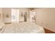 Comfortable bedroom boasts wood floors, bright natural light, and ensuite bath and closet at 2105 S Zinnia Ave # 468, Mesa, AZ 85209