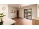 Light dining area with hardwood floors, modern fan, and sliding doors to the patio at 2105 S Zinnia Ave # 468, Mesa, AZ 85209