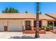 A single-story home showcasing brick accents, an attached garage, and desert landscaping at 2105 S Zinnia Ave # 468, Mesa, AZ 85209