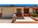 This house has brick accents, desert landscaping, and an inviting entrance with a security screen door at 2105 S Zinnia Ave # 468, Mesa, AZ 85209