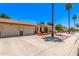 Street view of inviting single-story homes, featuring brick accents, desert landscaping, and driveways at 2105 S Zinnia Ave # 468, Mesa, AZ 85209