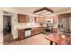 Functional kitchen featuring stainless steel appliances, light wood cabinets, and an efficient layout at 2105 S Zinnia Ave # 468, Mesa, AZ 85209