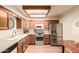 Stylish kitchen showcasing stainless steel appliances, light wood cabinetry, and recessed lighting at 2105 S Zinnia Ave # 468, Mesa, AZ 85209