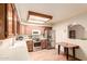 Kitchen view with stainless steel appliances, custom cabinets, and dining table at 2105 S Zinnia Ave # 468, Mesa, AZ 85209